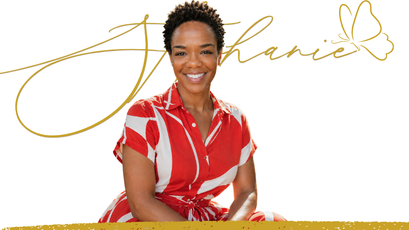 Stephanie Willis, smiling, in a red and white patterned dress